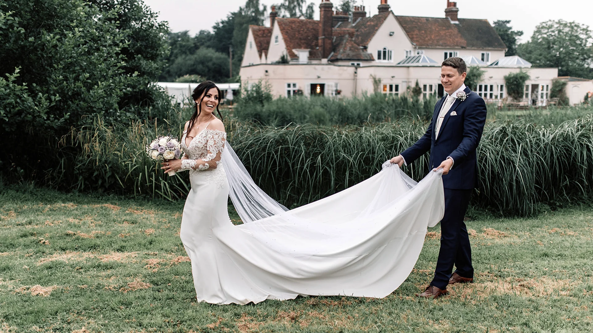 Outdoor wedding ceremony with cultural decorations at Prested Hall in Essex.