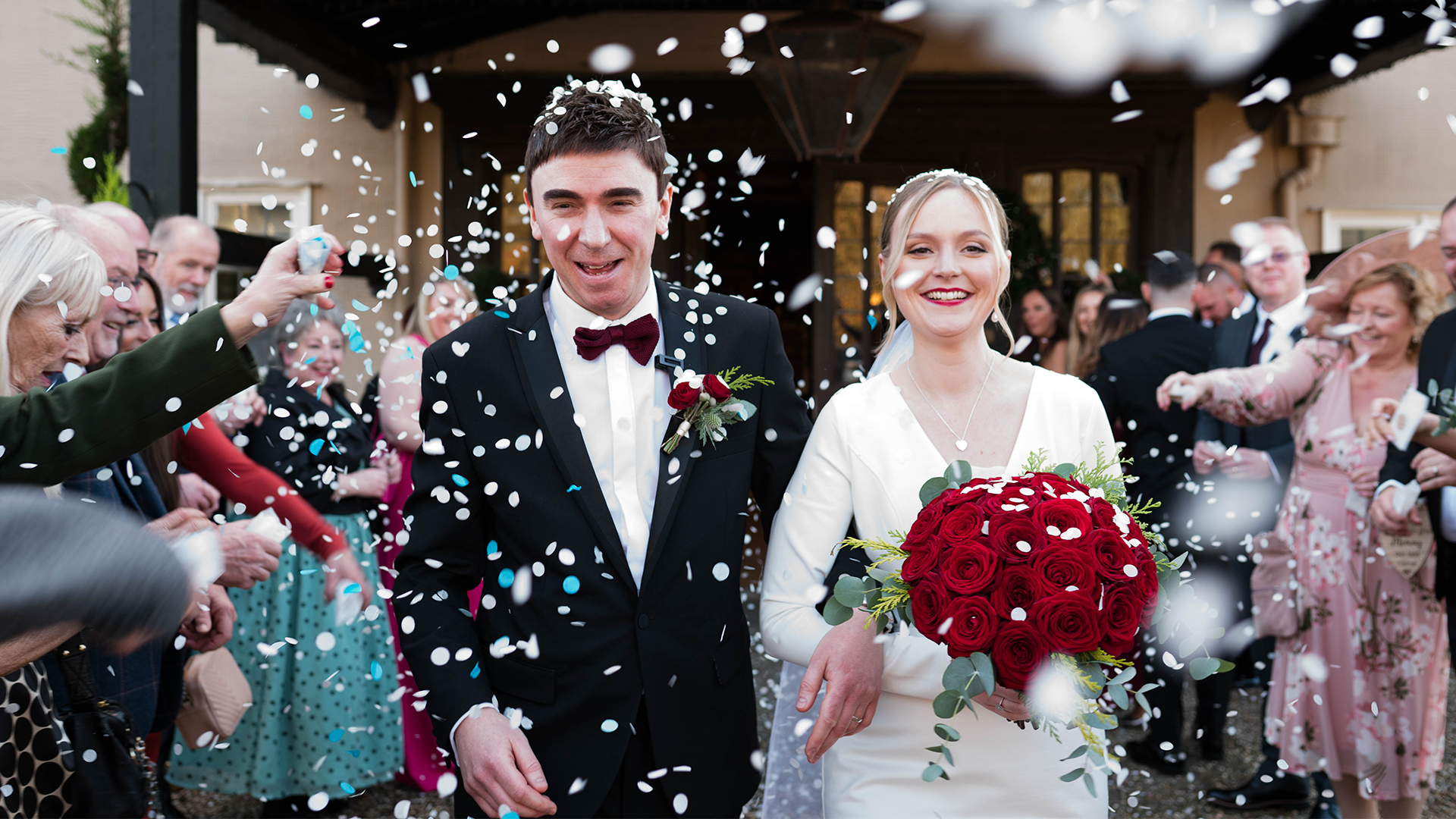 Blog 8 Bride and groom walking hand in hand during a sparkler farewell at Prested Hall Essex
