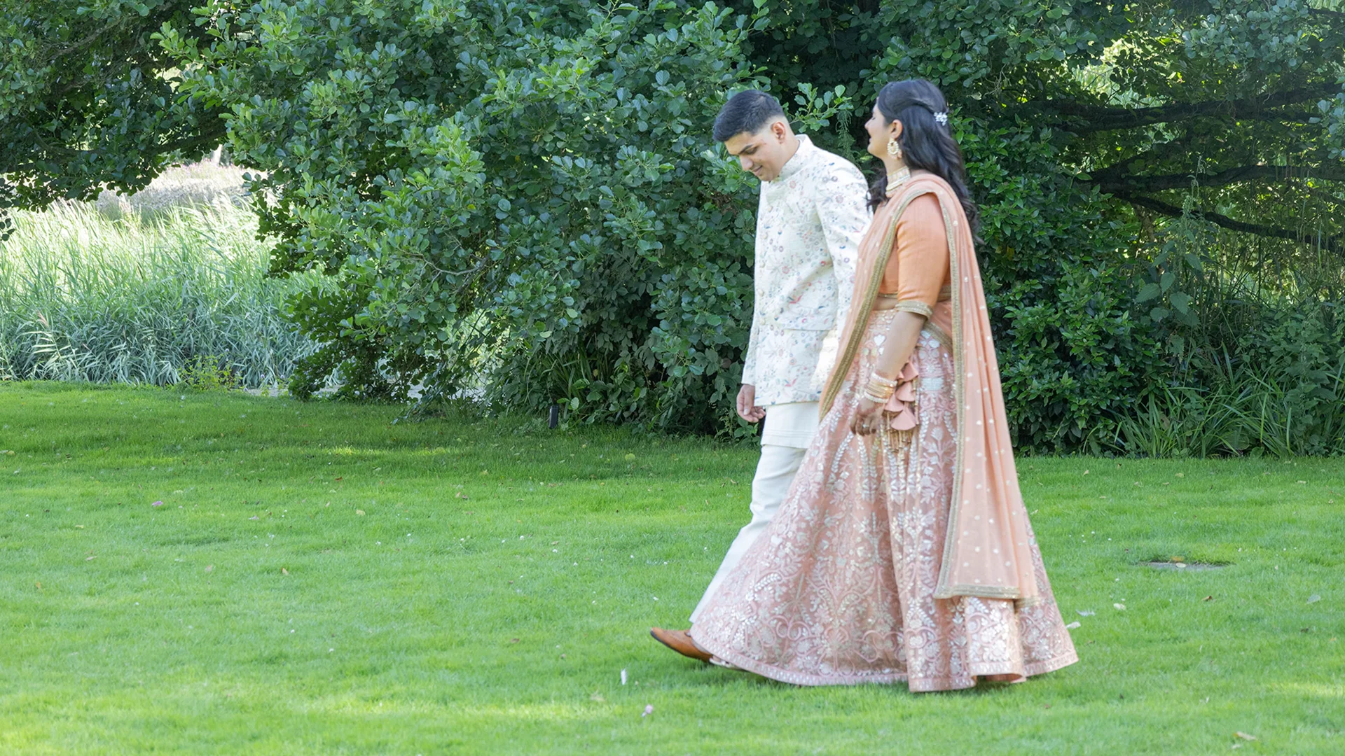 Blog 12 A couple enjoying a serene pre-wedding shoot by the misty moat, showcasing the beauty of a Morning Wedding Venue Essex.