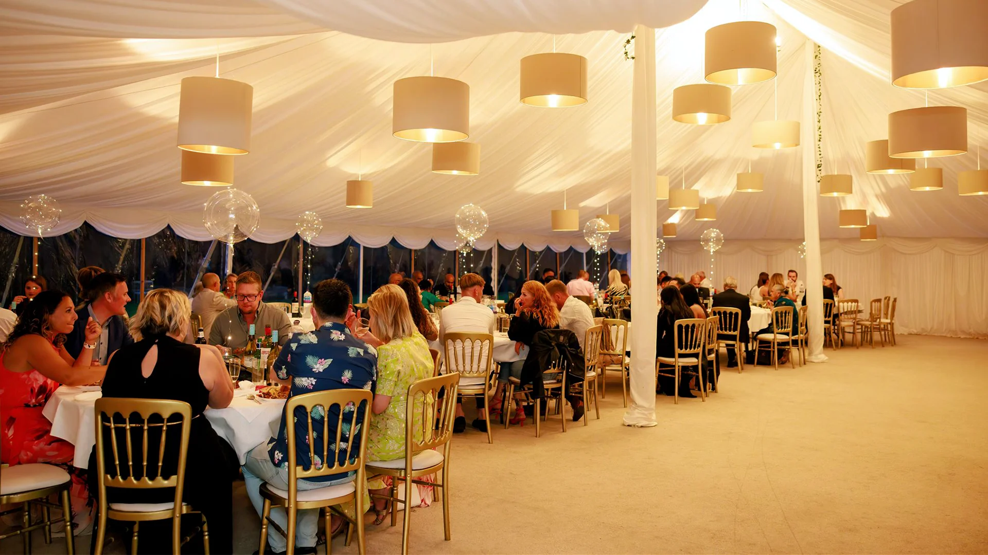 Blog 3 A breathtaking luxury reception featuring hanging floral installations and bespoke lighting inside a spectacular Marquee wedding venue Essex.