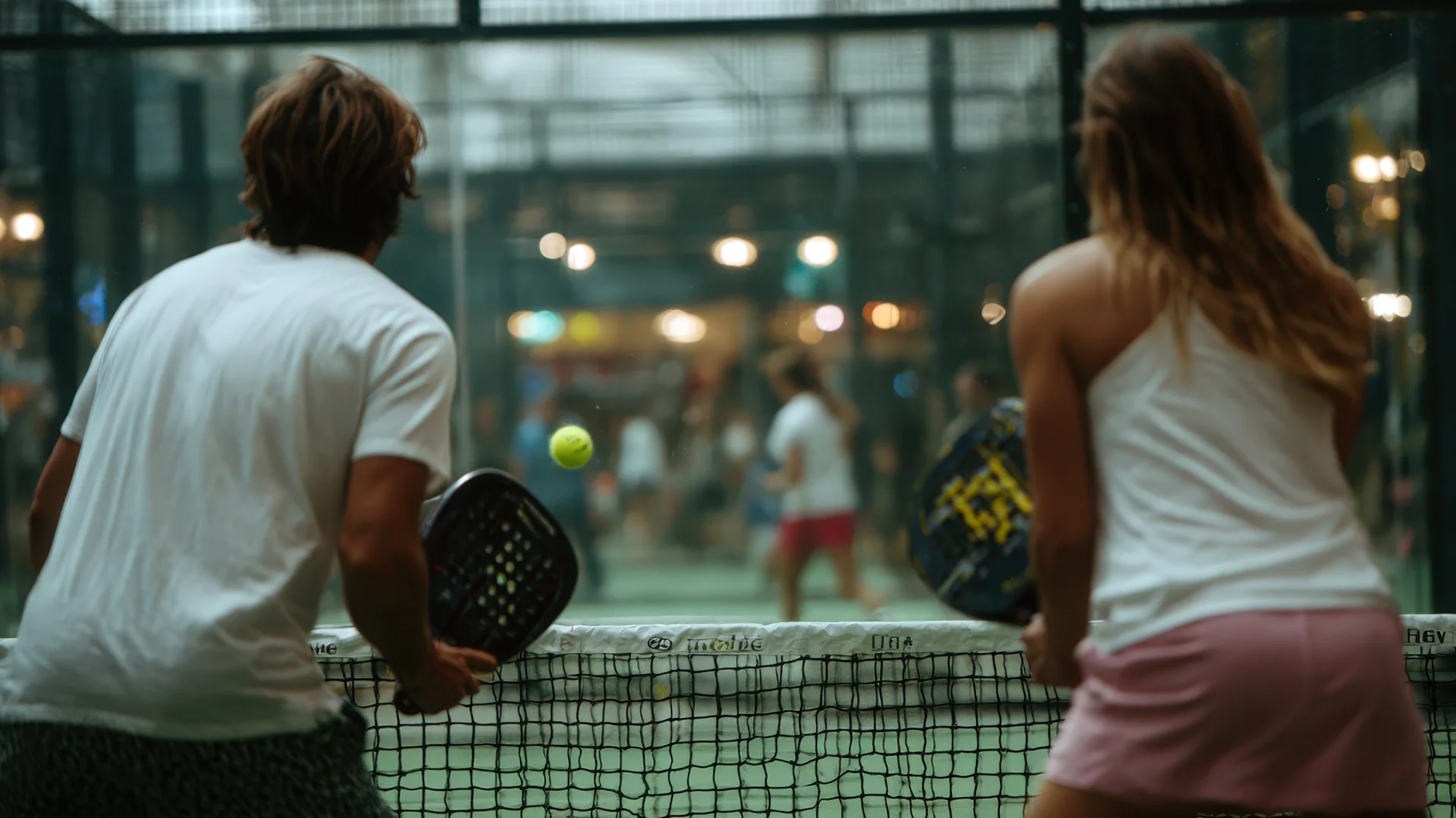 Blog 1 A energetic wedding party enjoying an interactive pre-wedding Padel match at a premier venue offering Team building wedding activities Essex.